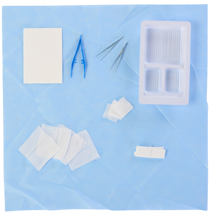 A surgical kit rests on a light blue surgical drape. The kit contains gauze pads, forceps, and a small, compartmentalized container.