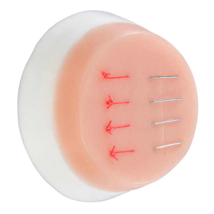 Side view of a Pristine Medical suture practice pad with stitches and sutures for training