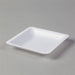 A white, square-shaped, shallow dish sits on a gray surface.