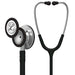 A Littmann stethoscope, composed of a silver chest piece and black tubing, rests on a white background.