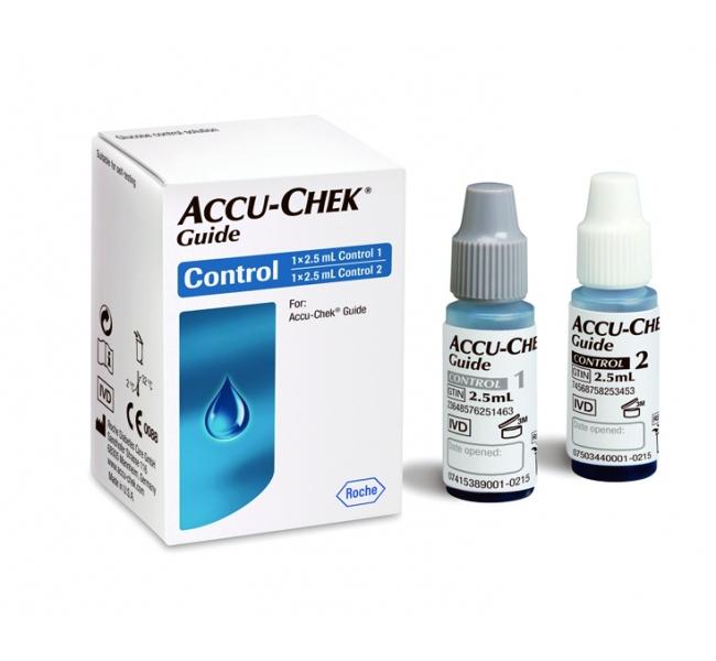 Two small Accu-Chek Guide control solution bottles, labeled 1 and 2, sit beside their packaging box. The box indicates the contents are for Accu-Chek Guide use.