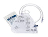 A sterile urine collection bag, with attached tubing and a separate packet, sits on a plain white background. The bag is graduated to measure urine volume.