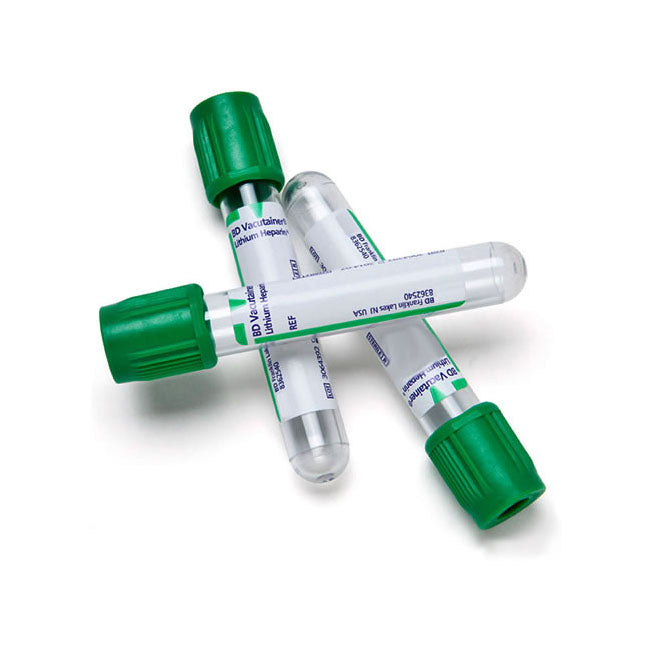 Three BD Vacutainer tubes, lying crisscrossed, rest on a white surface. The tubes are clear with green caps; labels indicate lithium heparin.