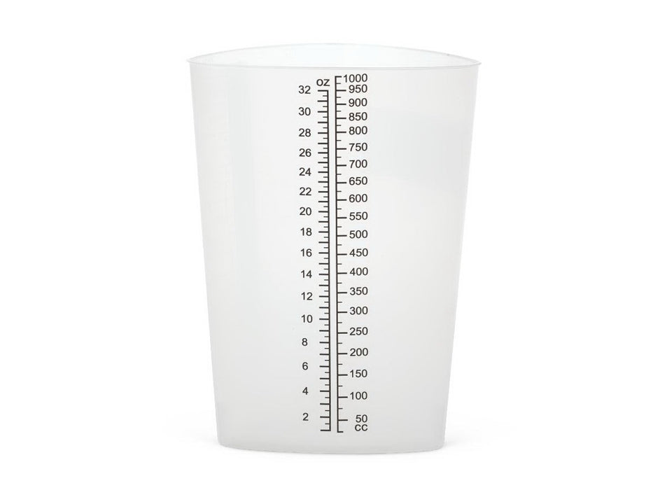 A cylindrical plastic measuring cup sits on a plain white background. It is transparent and features a vertical scale printed on its side for measuring volume.